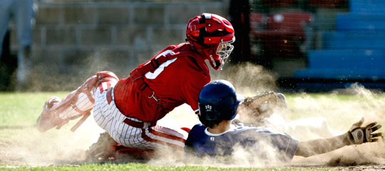 Matt Brown tags out Andrew Schumacher of Churchill on an inning ending double play.